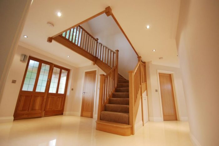 Large hall and galleried landing with oak staircase 