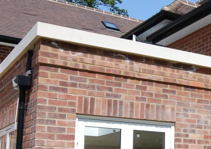 Orangery style extension with stone capped parapet roof