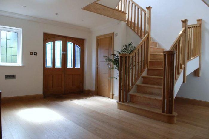 Master hall with feature oak staircase over two floors with vaulted ceiling