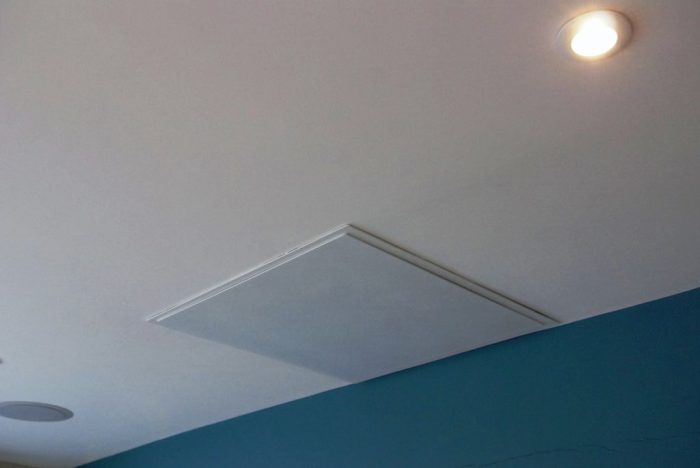 Projector in closed/off position concealed within ceiling