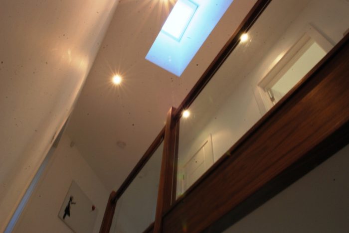 Roof light over first floor landing provides daylight to hall below and an interesting visual feature