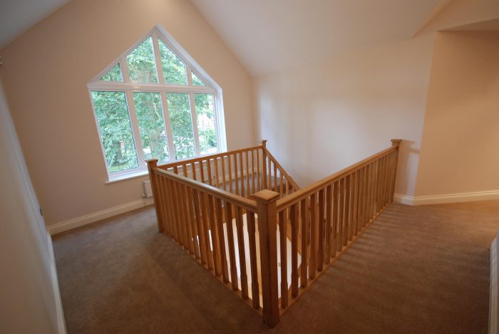 Large galleried landing with feature window and oak staircase 