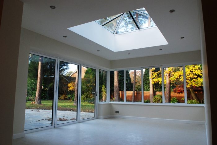 Orangery style extension with minimalist corner post and roof lantern