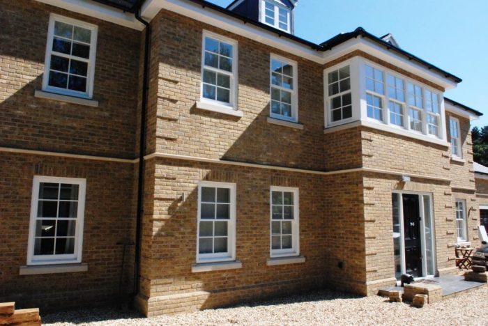 Subtle brickwork quoin detail and stonework cills/stringer course