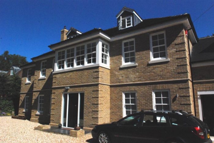 Subtle brickwork quoin detail and stonework cills/stringer course (porch not yet added)