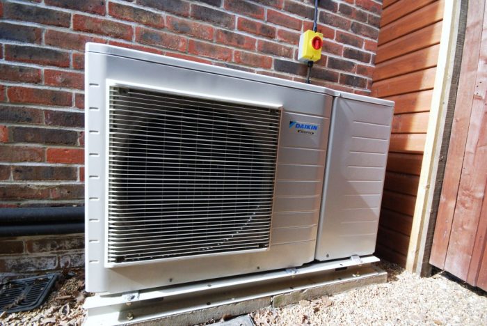 Air-source heat-pump provides heating and cooling via fan-coils