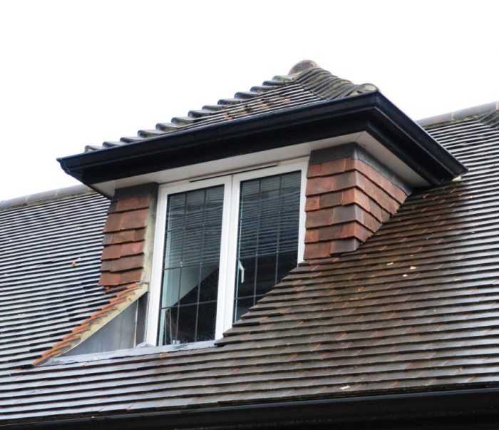Inset hipped dormer window with tiled cheeks
