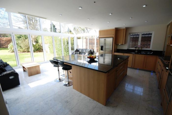 Open plan kitchen/family/dining area linked to patio/garden