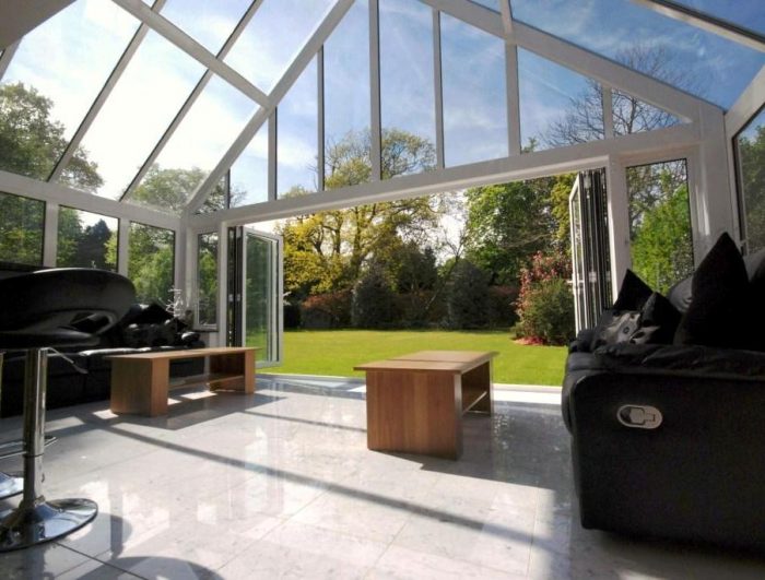Conservatory style family area linked to patio/garden