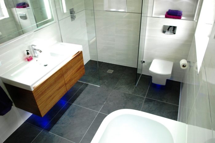 Wet room style bathroom. Wall hung vanity & WC emphasised with LED lighting