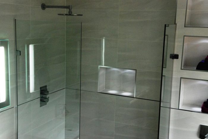 Family bathroom with in-built shelves, and LED lighting