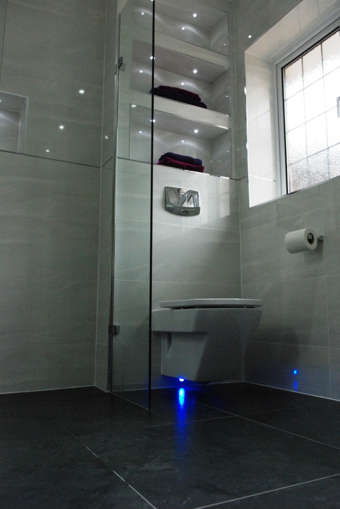 Family bathroom with in-built shelves, and LED lighting