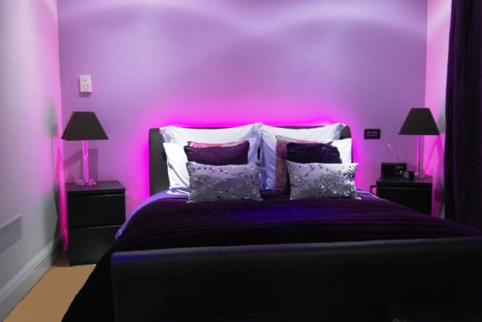 Decorative LED lighting behind bed