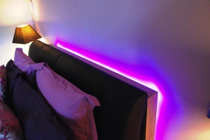 Decorative LED lighting behind bed