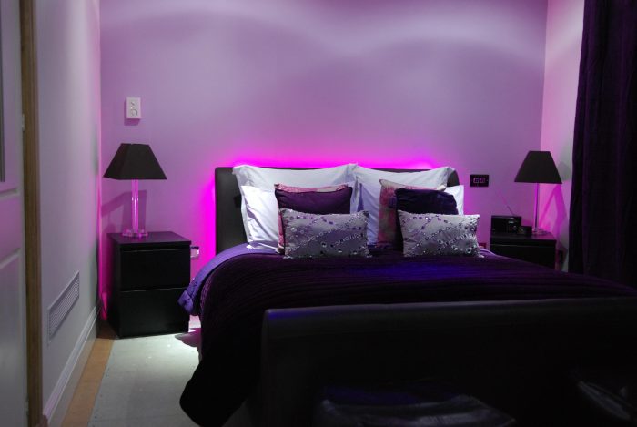 Decorative LED lighting behind bed