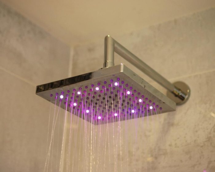 Shower head with LED integrated lighting