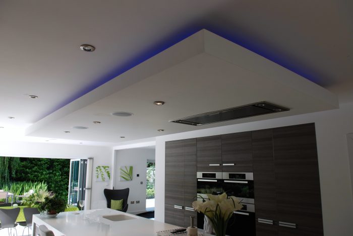 Island feature conceals extractor fan ducting and provides interesting decorative feature with LED lighting