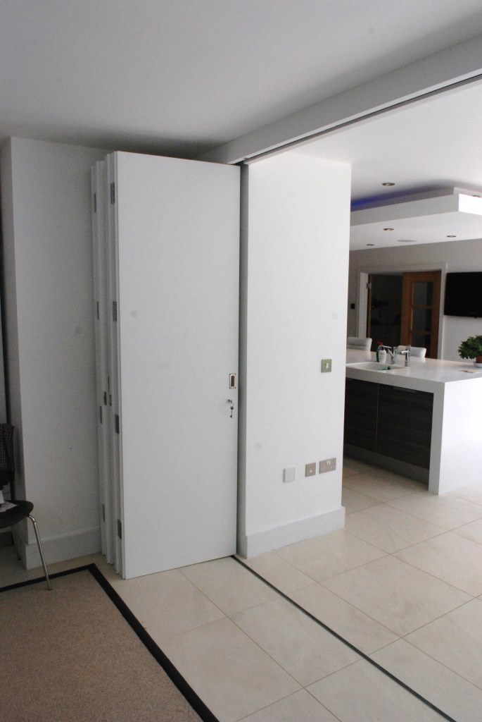 Folding/sliding door system to segregate family space as required.