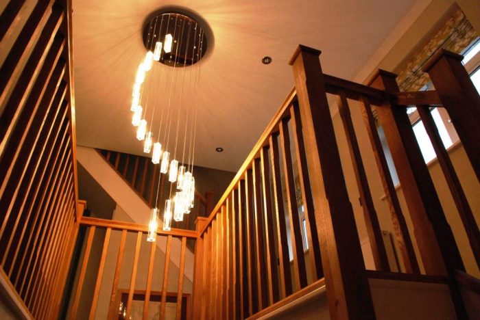 Oak staircase and galleried landing with feature light over