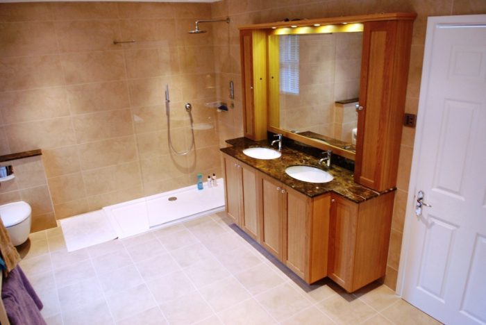 Master en-suite with oak vanity sink/mirror unit