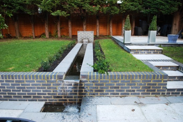 Contemporary garden / patio with water feature