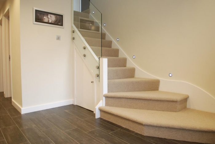 Contemporary stairs with glazed balustrade system and LED lighting