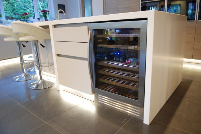 Drinks fridge in centre island featuring LED plinth lighting